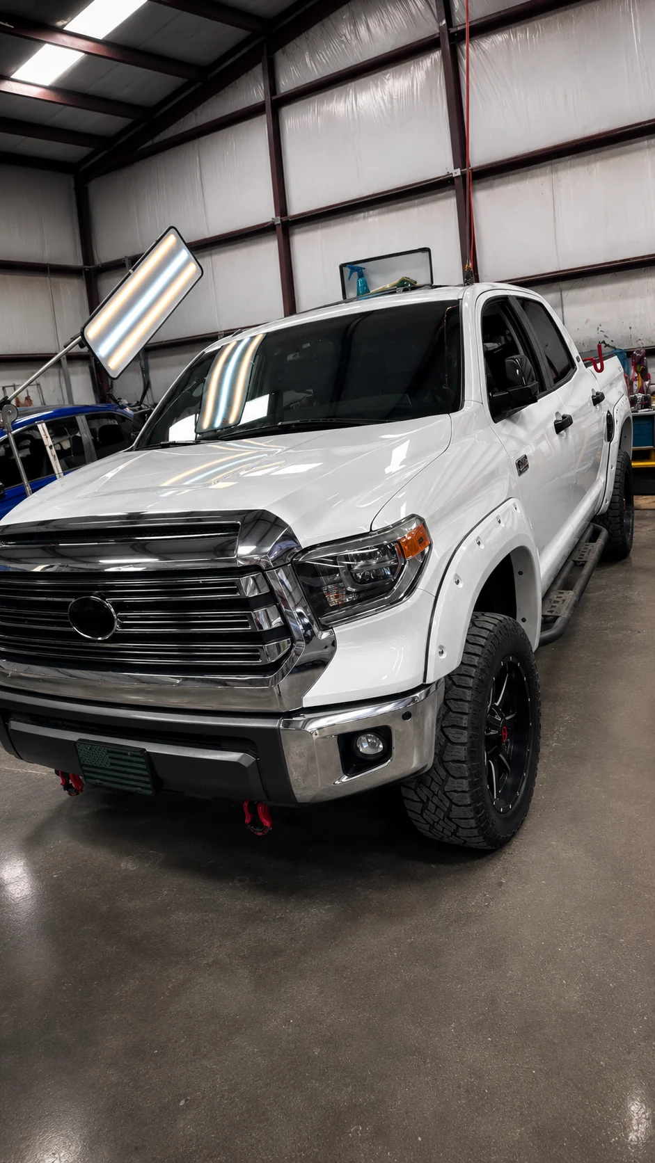 Vehicle being inspected in an automotive repair shop